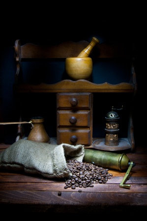 Vintage coffee grinder and cezve with roasted coffee beansの写真素材
