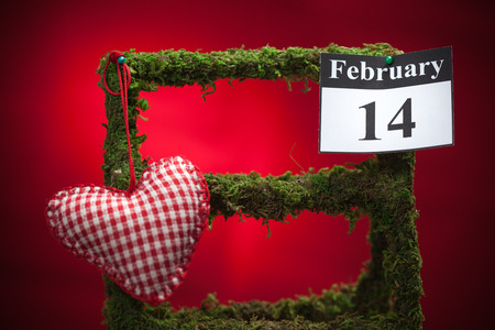 February 14, on the calendar, Valentine's day, red heart, red backgroundの写真素材