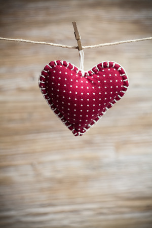 Colorful fabric hearts on wood backgrounds. Valentine's Love conceptの写真素材