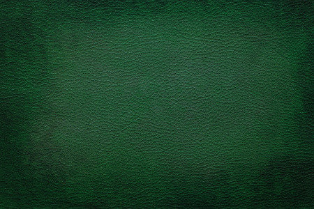 Old vintage green leather texture closeup can be used as backgroundの写真素材