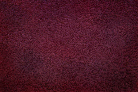 Old vintage red leather texture closeup can be used as backgroundの写真素材