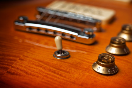 Detail Picture of a vintage, classic electric guitar with shallow depth of field