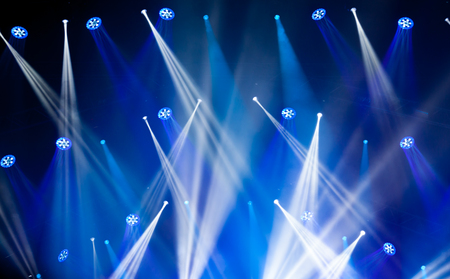 Stage lights on concert. Lighting equipment with blue colored beams.の写真素材