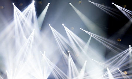 Stage lights on concert. Lighting equipment with white colored beams.の写真素材