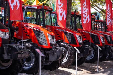 Novi Sad, Serbia: may 9. 2015 - Novi Sad Agro fair with people and Fair show. Modern tractors and harvester on display on Agricultural fairのeditorial素材