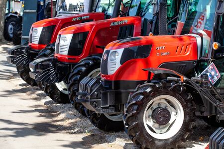 Novi Sad, Serbia: may 9. 2015 - Novi Sad Agro fair with people and Fair show. Modern tractors and harvester on display on Agricultural fairのeditorial素材