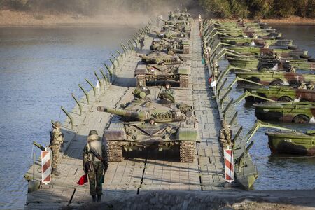 NEAR TITEL, SERBIA - NOVEMBER 07 2018; Serbian Army main battle tank M84 (version of Soviet T-72) crews during river fleet. Serbia will mark the 100th anniversary of the victory in the First World War with a great military exercise "The Victory Day"のeditorial素材