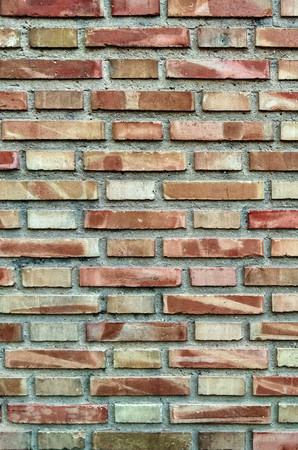 Brick wall with different colorful piecesの写真素材