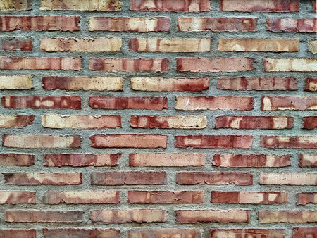 Brick wall with different colorful piecesの写真素材