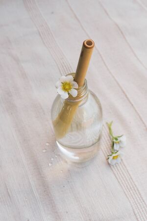 Eco Bamboo Straw on a refreshing soft summer drink with flowers. Eco friendly and natural concept. Top view.の写真素材