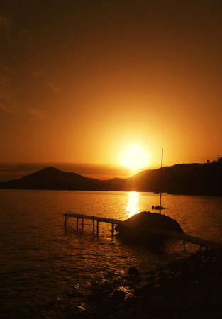 amazing sunset, sea and mountainsの写真素材
