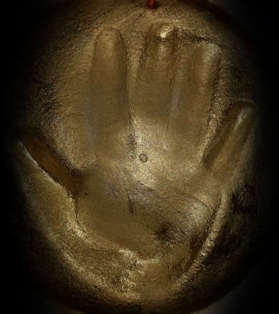 children's hand print in clayの写真素材