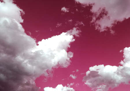 amazing pink sky with white cloudsの写真素材
