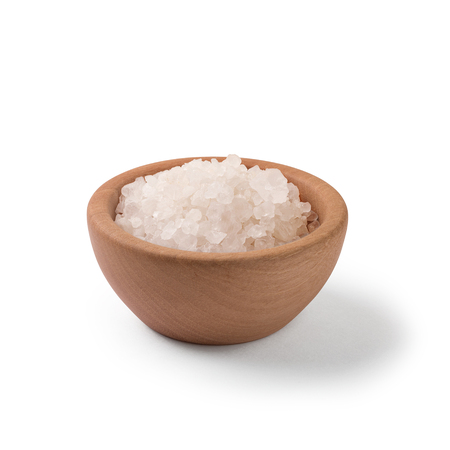 Sea salt in wooden bowl on white background with clipping path.の写真素材