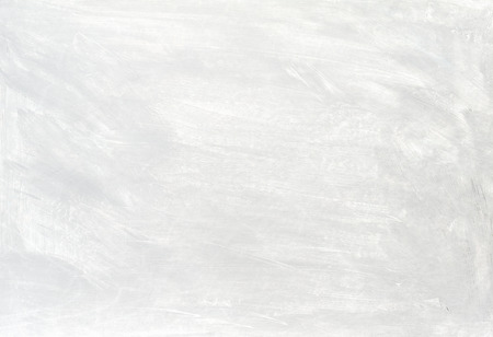 White washed painted textured abstract background with brush strokes in gray and black shades.