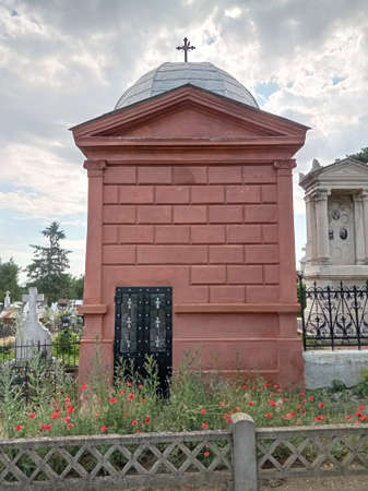 Brick-red mausoleum in a cemeteryの写真素材