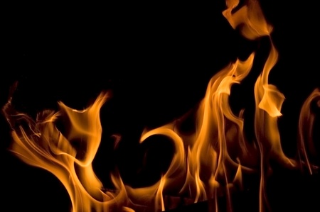 flame of burning fire in fireplaceの写真素材