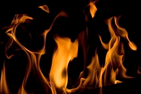 flame of burning fire in fireplaceの写真素材