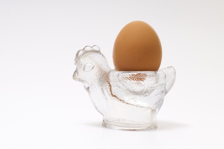 egg on chicken eggcup made by glass