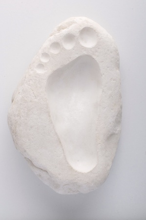 footstep sculpted on the marbleの写真素材