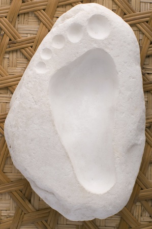 footstep sculpted on the marbleの写真素材