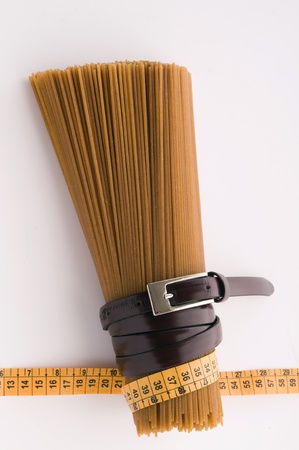 wholegrain spaghetti and belt and measureの写真素材