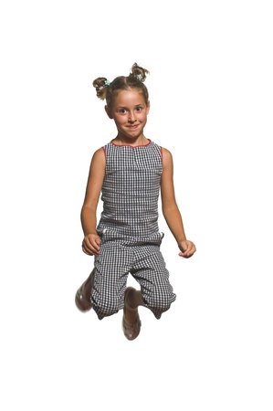 young girl jumping with joyの写真素材