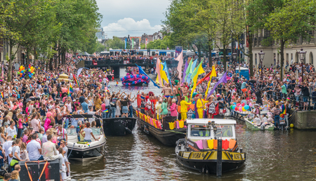 Amsterdam, August 5 2017: Boats of the 2017 Canal parade sailing over the canals of the Prinsengracht in the center of Amsterdamのeditorial素材