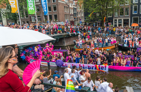 Amsterdam, August 5 2017: Boats of the 2017 Canal parade sailing over the canals of the Prinsengracht in the center of Amsterdamのeditorial素材