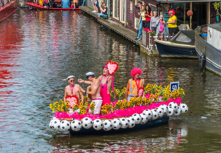 Amsterdam, August 5 2017: smallesr boat of the 2017 Canal parade sailing over the canals of the Prinsengracht in the center of Amsterdamのeditorial素材