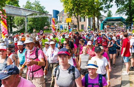 Nijmegen July 19 2017: 4Day Walking tournament contestants passing the village of Wijchenのeditorial素材