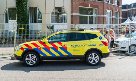 Nijmegen July 21 2017: Ambulance medical vehicle waiting in alley during the 4Day walking tournamentのeditorial素材