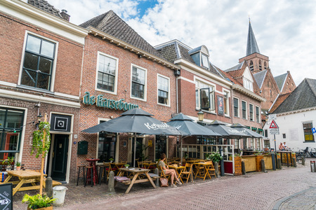 Amersfoort, the Netherlands July 22 2017: locals sitting at a terraces in front of restaurants in the old city of Amersfoortのeditorial素材