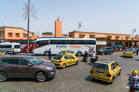 Marrakech, Morocco May 18 2017: Busy traffic with busses, taxis, scooters and cars in the center of the old townのeditorial素材