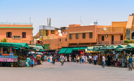 Marrakech, Morocco May 18 2017: Tourists and locals shopping on the Jamma El Fna square entering and leaving the medima in the center of Marrakechのeditorial素材