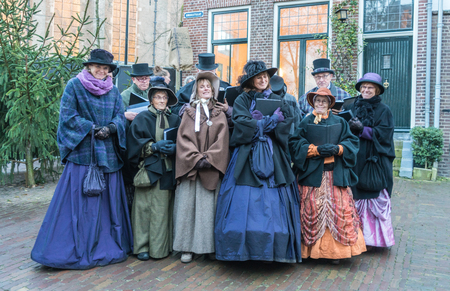 Deventer, the Netherlands, December 17th 2017: Choir of  dressed actors singing inside the Dickens festivalのeditorial素材