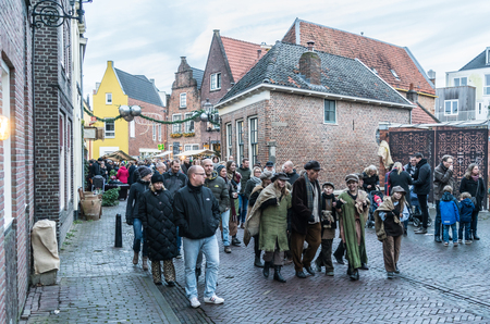 Deventer, the Netherlands, December 17th 2017: Visitors and dressed actors walking inside the Dickens festivalのeditorial素材