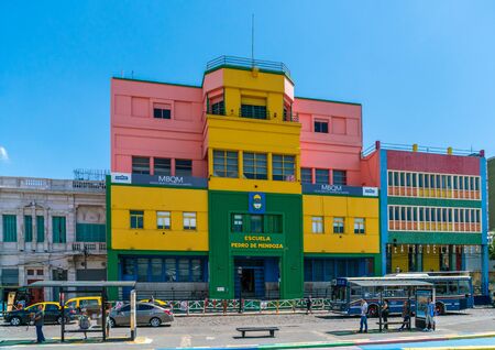 Tourists visiting the famous coloured houses at La Boca in front of the Escuela Pedro de Mendoza (School), La Boca, Buenos Aires, Argentina - January 22th 2019のeditorial素材