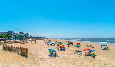 Tourists and locals enjoying the summer on playa Carrasco (Carrasco beach), Montevideo, Uruguay, January 27th 2019のeditorial素材