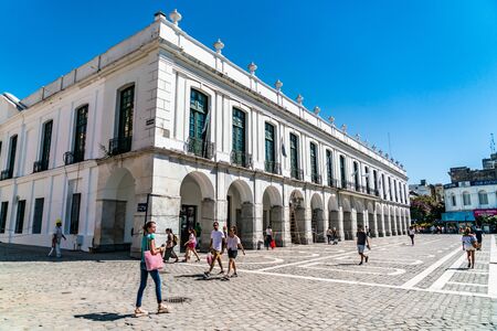 Cordoba, Argentina - February 20th 2019, Locals and tourist passing a colonial building at the Plaza...