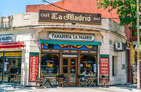 Exterior of a local restaurant with tourists enjoying a meal in one of the famous coloured houses, La Boca, Buenos Aires, Argentina - January 22th 2019のeditorial素材