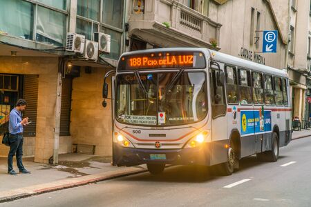 Bus stops to let passeners in on a street in, Montevideo, Uruguay, January 25th 2019のeditorial素材