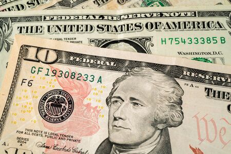 US Dollars close up ten and one dollar notes