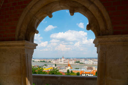 Budapest, Hungary - June 27th 2020 - Hungarian Parliament Building seen from the Fisherman's Bastion during Corona time on a sunny day with some tourists visiting the churchのeditorial素材