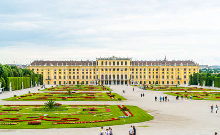 Vienna, Austria - June 25th 2020 - Exterior of the rear of Schloss Schonbrunn during Corona time on a sunny day with some tourists visiting the palaceのeditorial素材