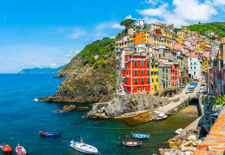 Cinque Terre, Italy - July 1st 2020 - Overview of the village Riomaggiore with a very quiet square due to Corona, one of the towns known as Cinque Terre at the Medeteranian coast of Italy on a sunny Corona day in summerのeditorial素材
