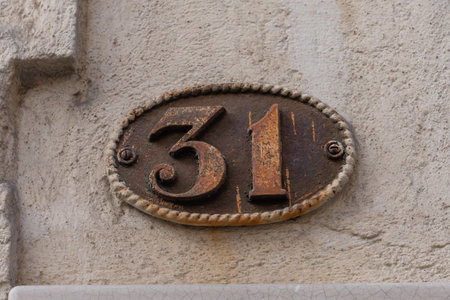 House number 31 in old french style rusty metalの写真素材