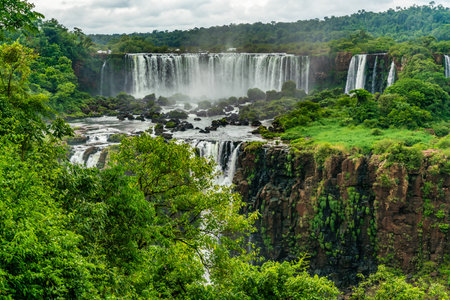 Iguazu Falls seen from the Brazilian side with tourist boat on small lakeの写真素材