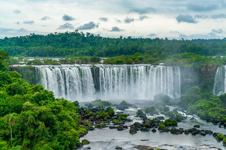 Iguazu Falls seen from the Brazilian side with tourist boat on small lakeの写真素材