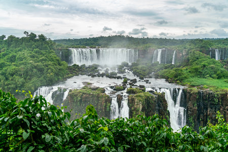 Iguazu Falls seen from the Brazilian side with tourist boat on small lakeの写真素材